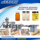 AUTOMATIC WEIGHING FILLING AND CAPPING LINE - Mesin Pengemas Otomatis 1